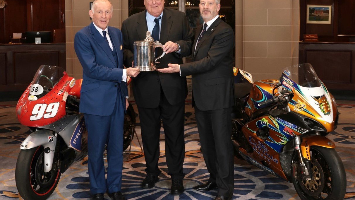 Ben Cussons and Barrie Baxter present Mike Trimby with the Torrens Trophy